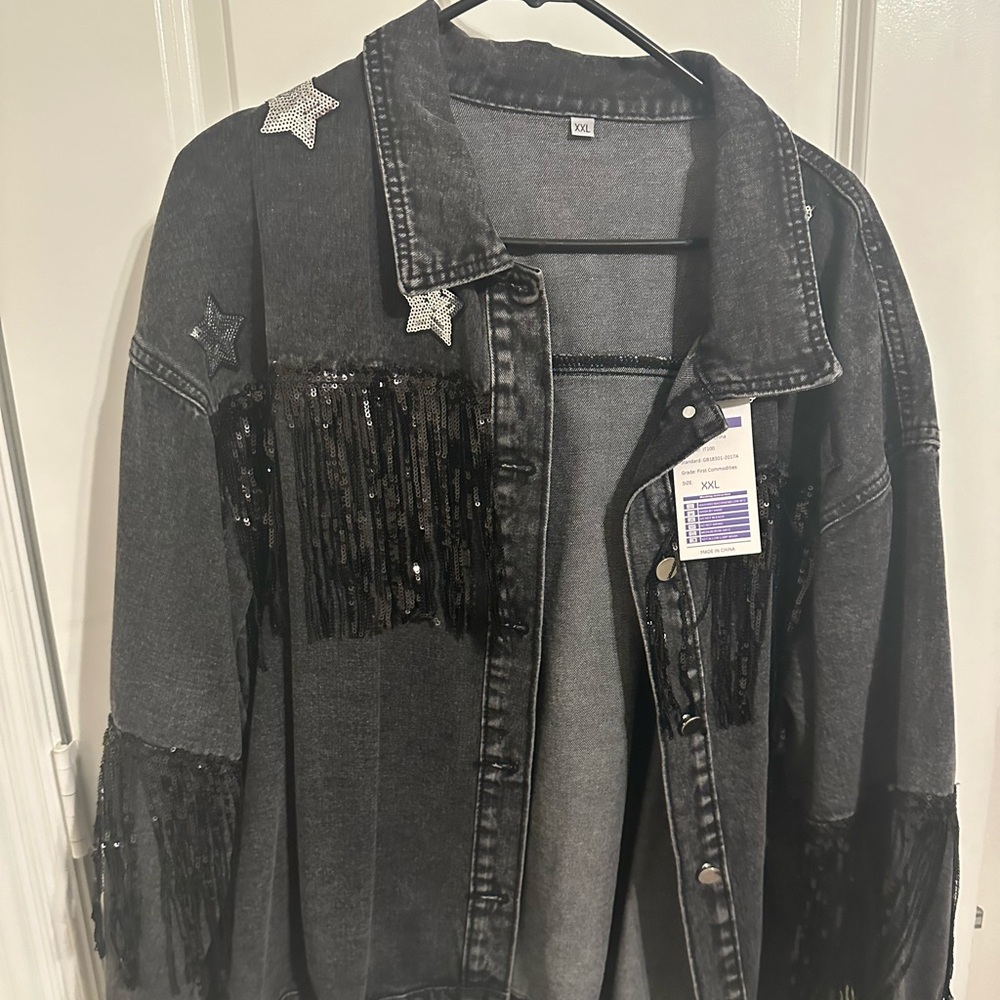 Black jean jacket with fringe and silver sequins stars

Size XXL